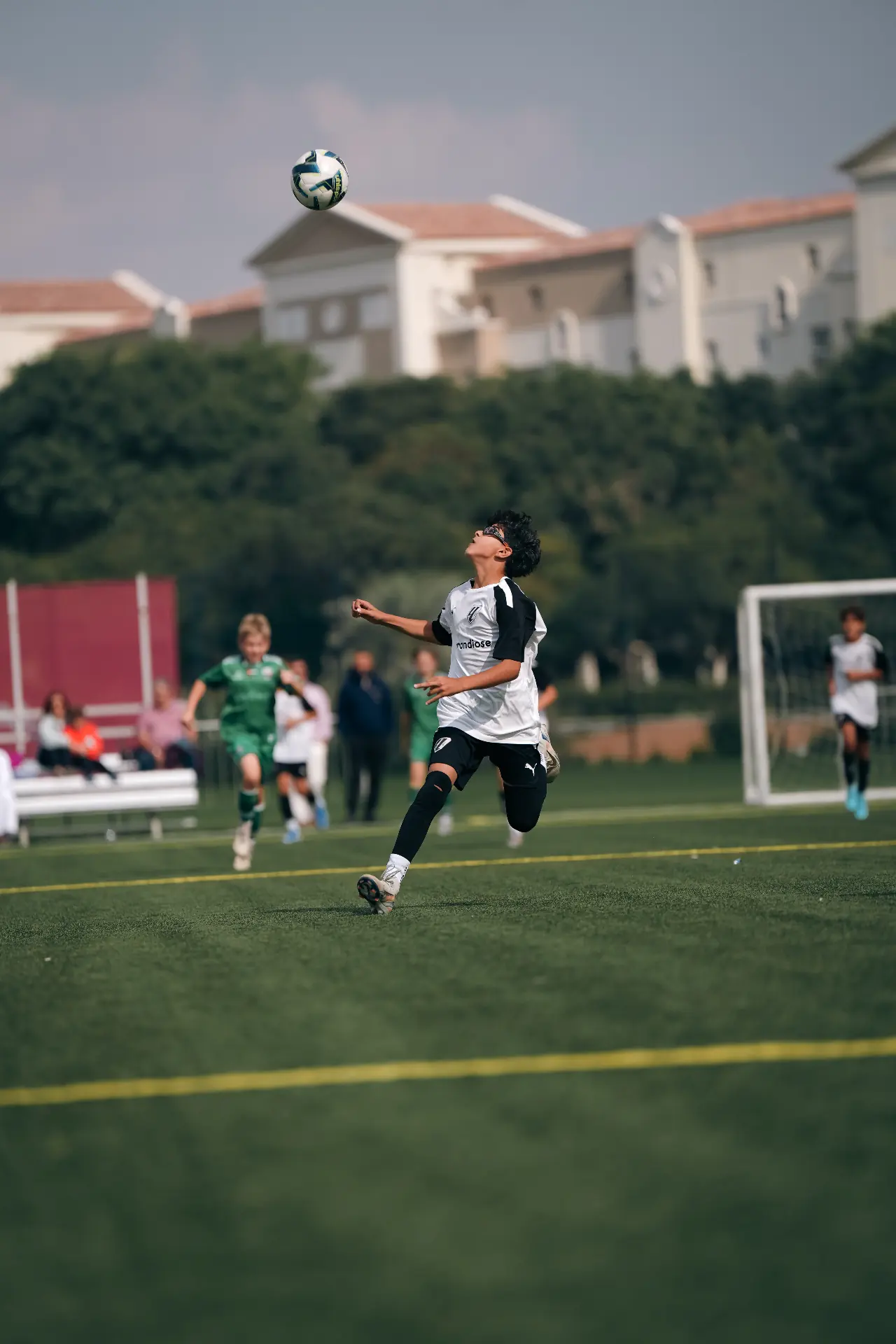 Player controlling a high ball in mid-air