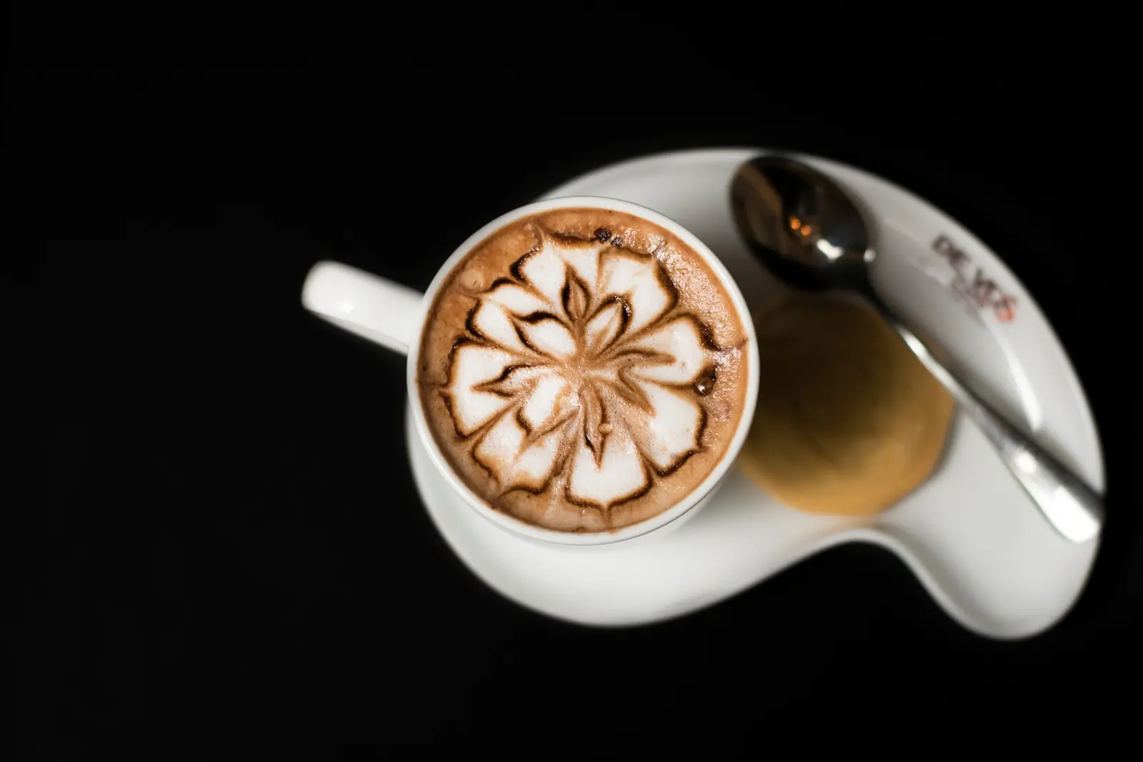Cappuccino latte art on black