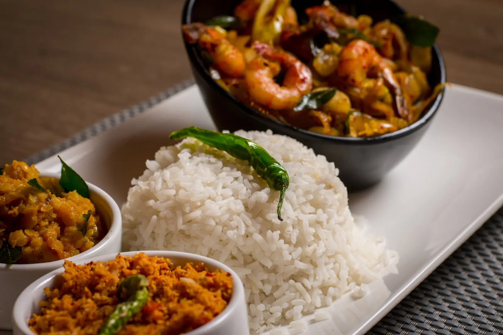 Prawn curry with coconut rice and sambol