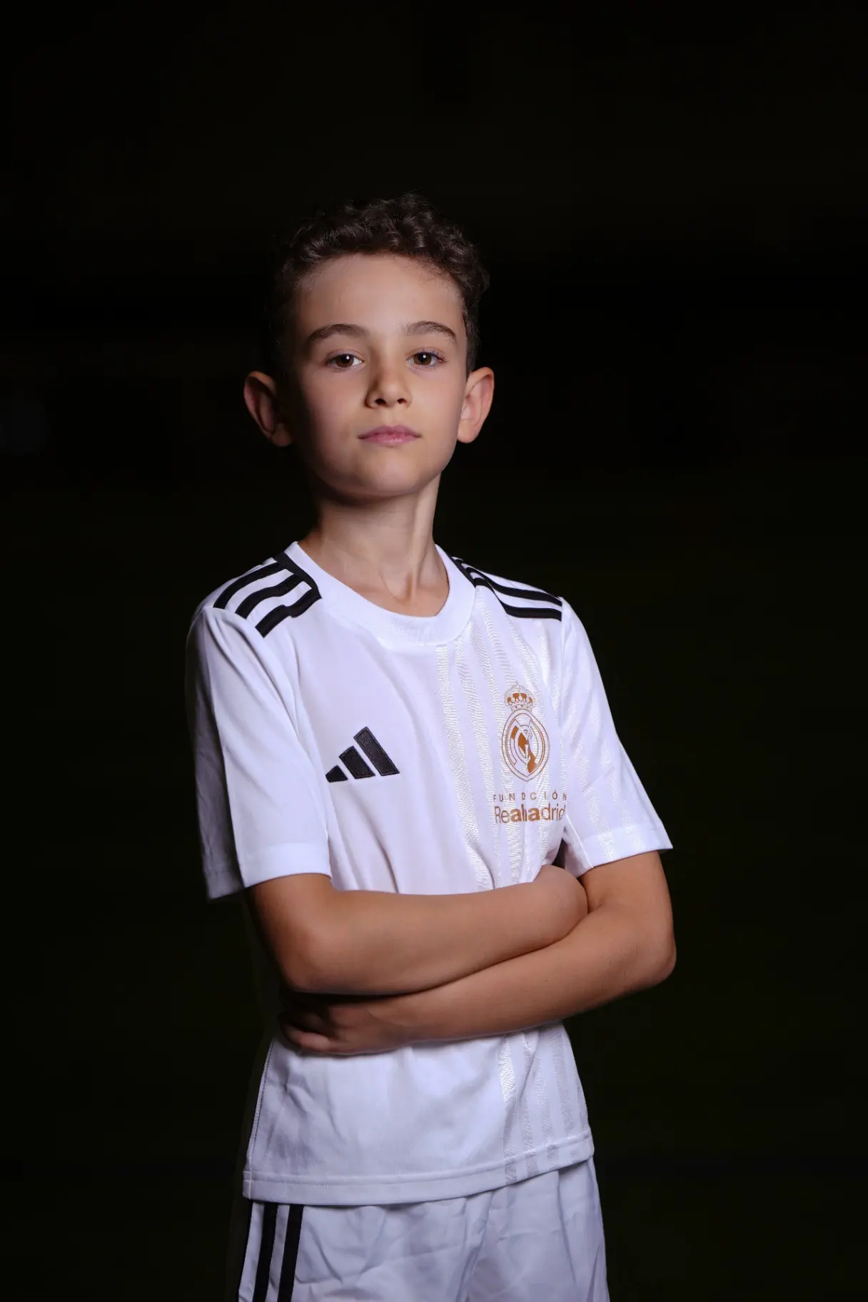 Studio portrait — Real Madrid academy kit on black