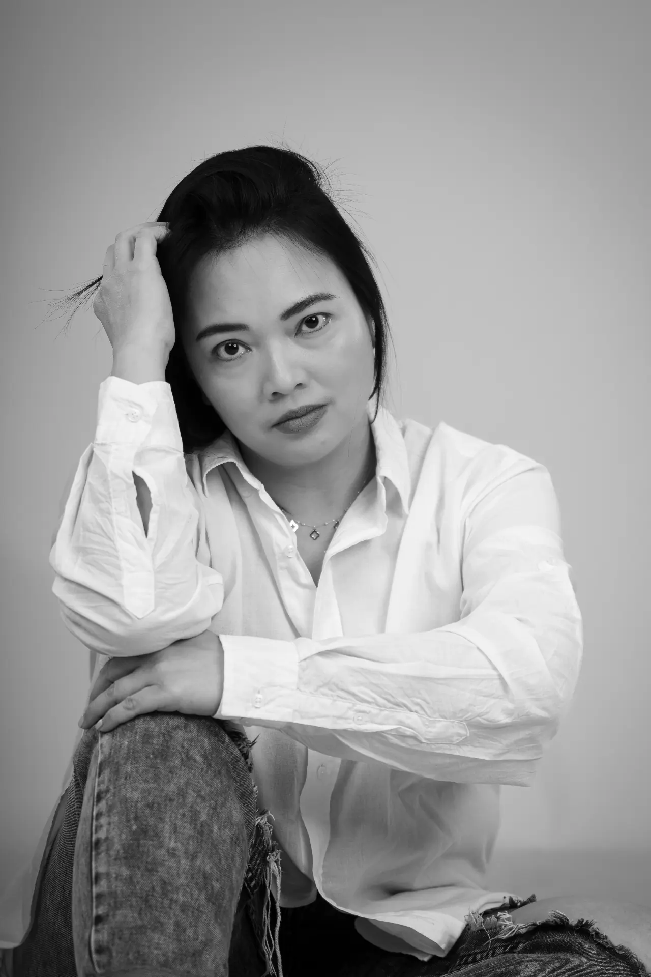 Black and white studio portrait — white shirt