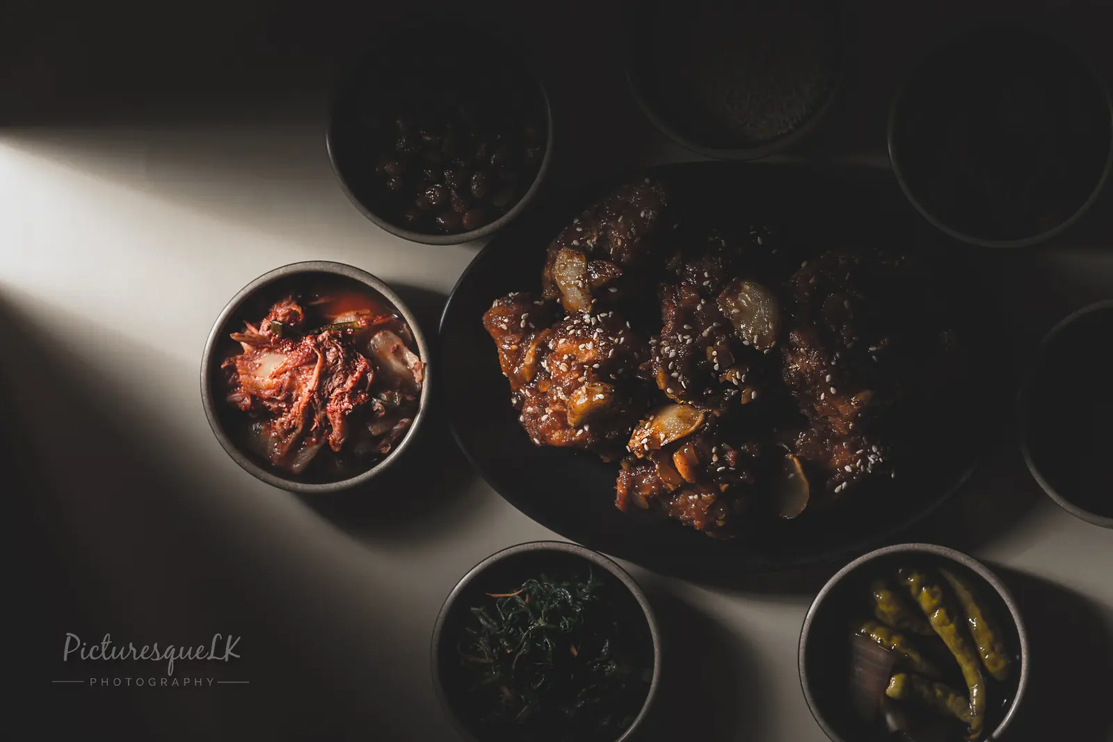 Korean fried chicken flatlay with banchan